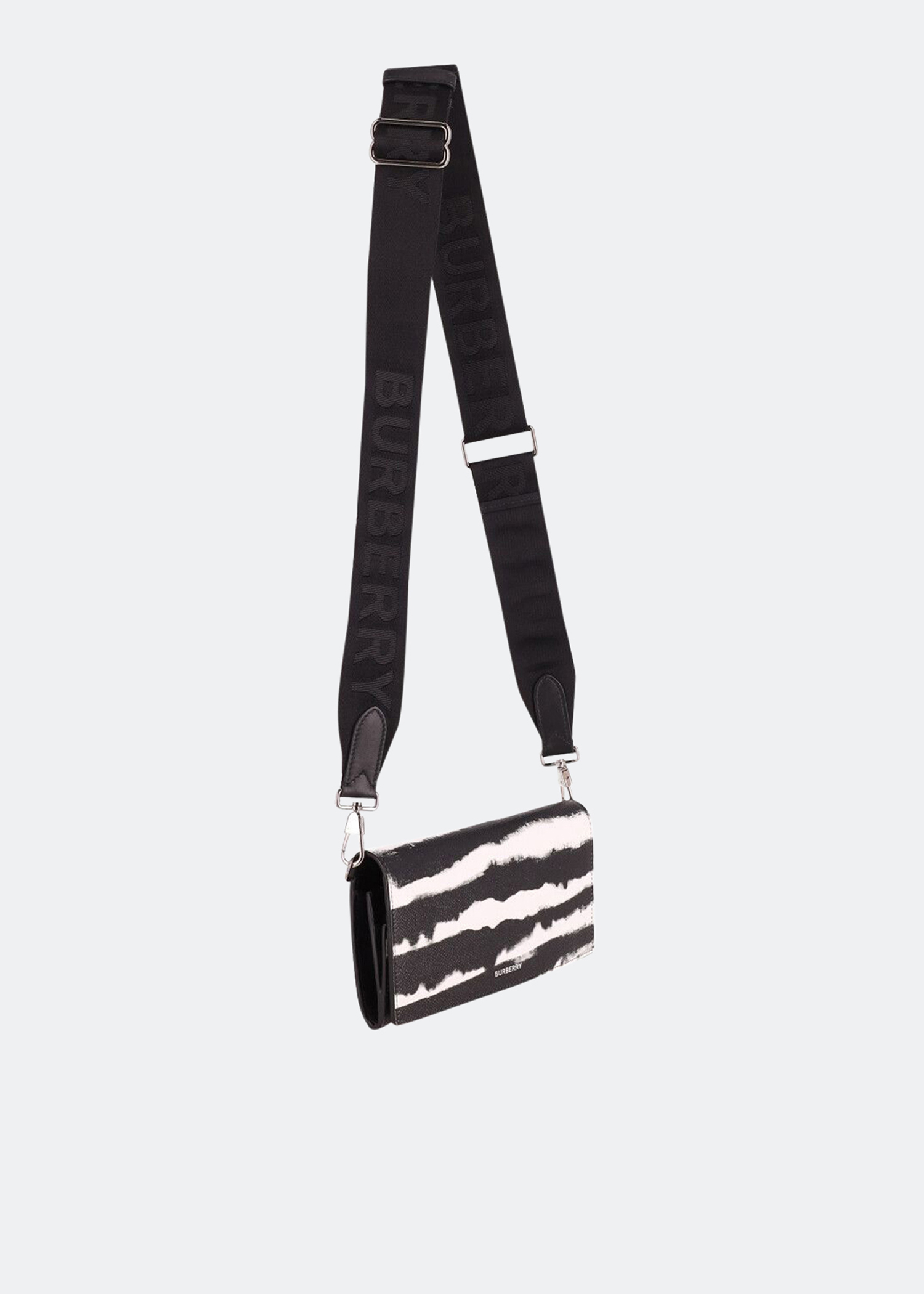 Ollie Zebra wallet with shoulder strap in black and white leather, Animal print
Ollie Zebra wallet with shoulder strap in black and white leather, Animal print