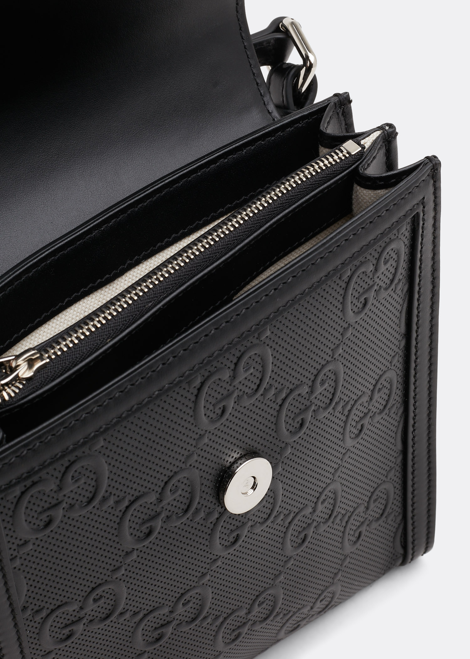 Gucci GG Embossed Leather Messenger Bag in Black for Men