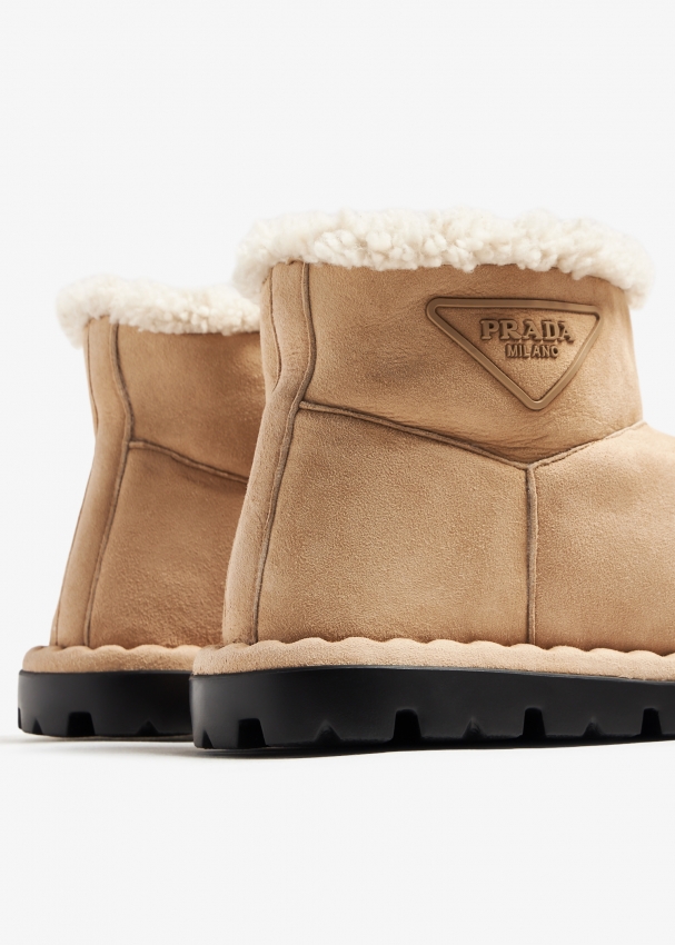 Prada Shearling booties for Women - Beige in Bahrain | Level Shoes