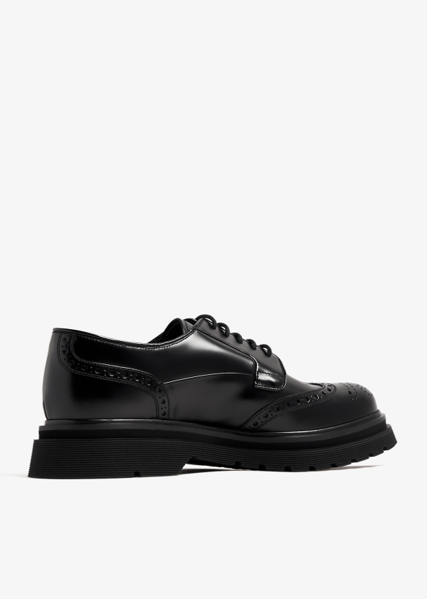 Prada Brushed Leather Derby brogue shoes for Men - Black in UAE | Level ...