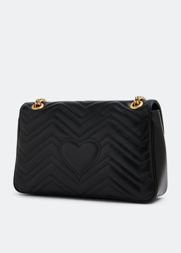 Gucci bag with heart sales on back
