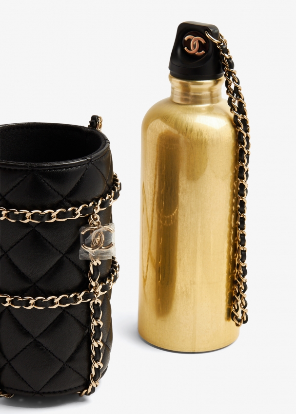 Care for a gold-colored Chanel water bottle with a flask bag for